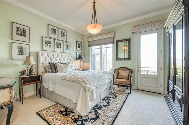 bedroom with carpet floors, ornamental molding, baseboards, and access to outside