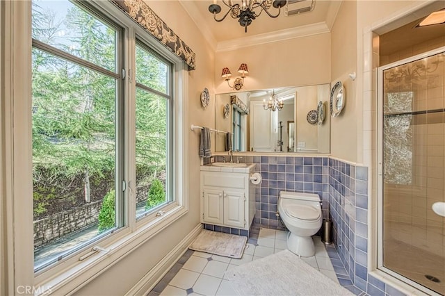 full bathroom featuring a wealth of natural light, toilet, a stall shower, and ornamental molding