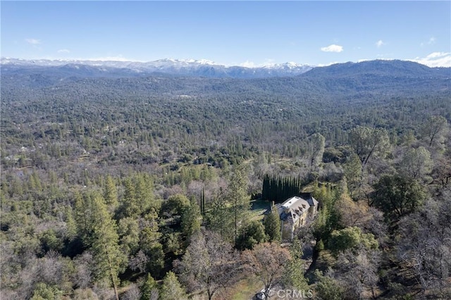 aerial view featuring a mountain view and a forest view