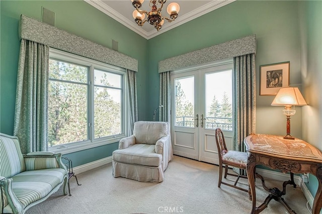 interior space featuring baseboards, french doors, crown molding, a notable chandelier, and light colored carpet