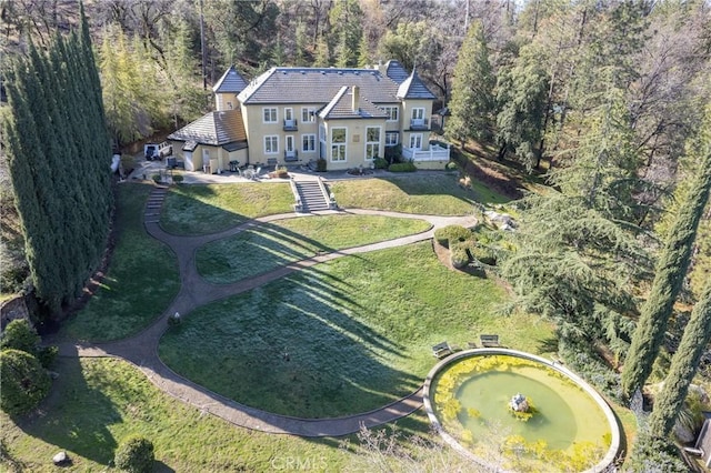 bird's eye view featuring a forest view