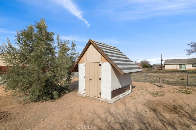 view of shed with fence