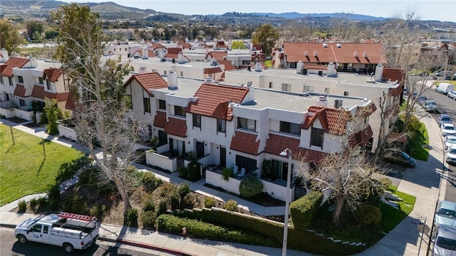 birds eye view of property featuring a mountain view and a residential view