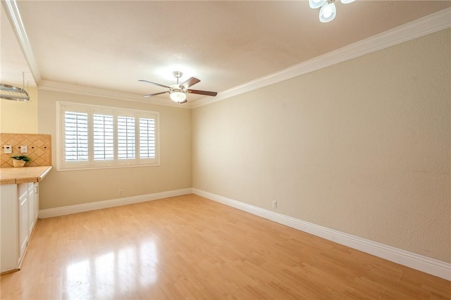 27666 Nugget Dr Unit 3, Canyon Country, CA 91387 - unfurnished living room featuring light wood-style floors, ceiling fan, crown molding, and baseboards