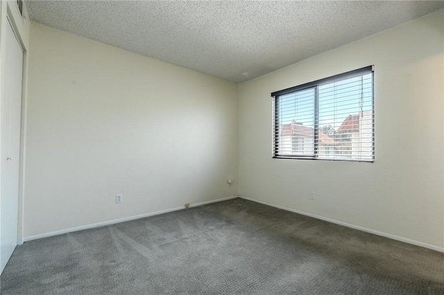 27666 Nugget Dr Unit 3, Canyon Country, CA 91387 - unfurnished room with carpet flooring, a textured ceiling, and baseboards