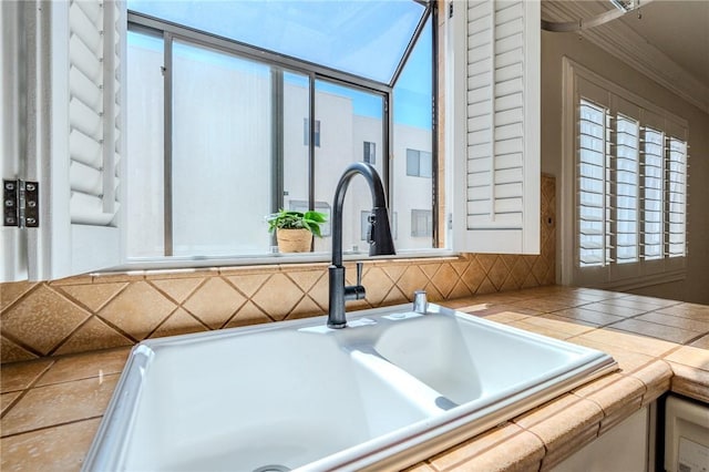 27666 Nugget Dr Unit 3, Canyon Country, CA 91387 - kitchen view of a sink, tile counters, and ornamental molding