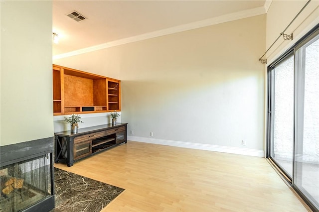 27666 Nugget Dr Unit 3, Canyon Country, CA 91387 - unfurnished living room featuring crown molding, light wood finished floors, and baseboards