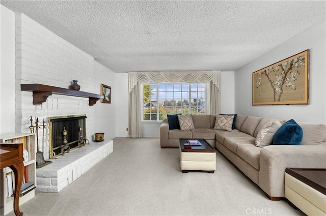 living area featuring carpet floors, a textured ceiling, and a fireplace