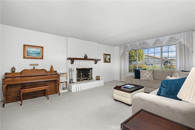 carpeted living room featuring a fireplace and a textured ceiling