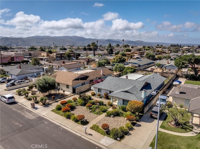 aerial view with a mountain view and a residential view