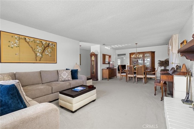 living room with light colored carpet, a chandelier, and a textured ceiling