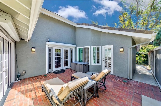 view of patio / terrace with french doors and fence