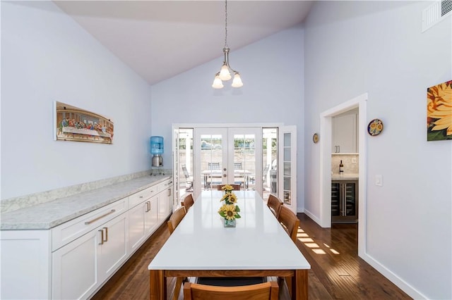 dining space with visible vents, dark wood-style floors, french doors, wine cooler, and baseboards