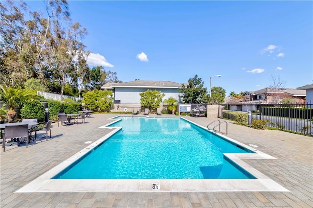 view of pool featuring a fenced in pool, a patio, and fence