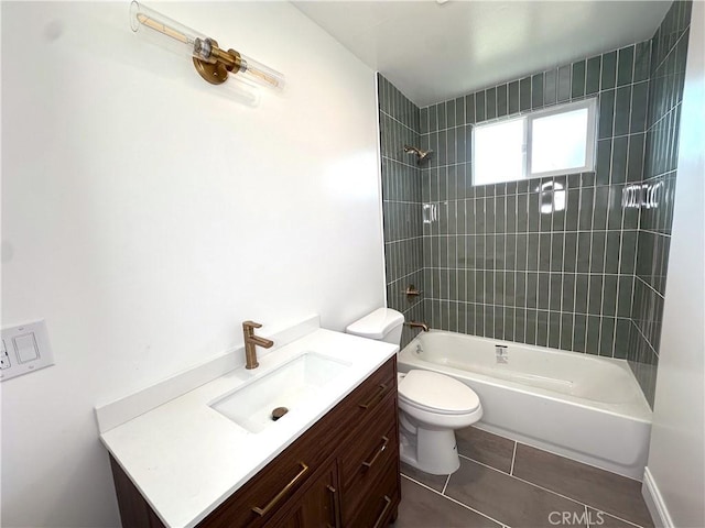 bathroom with tile patterned flooring, vanity, toilet, and bathtub / shower combination