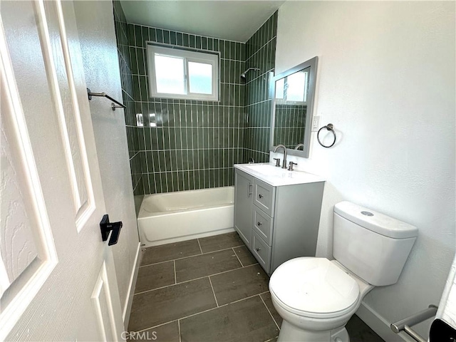 full bathroom with vanity, toilet, baseboards, and shower / bath combination