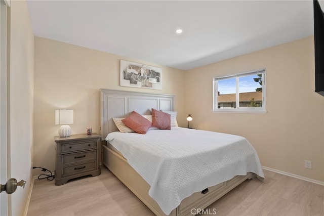 bedroom with recessed lighting, baseboards, and light wood-style floors