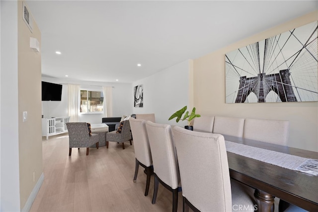 dining space with recessed lighting, visible vents, light wood-style flooring, and baseboards