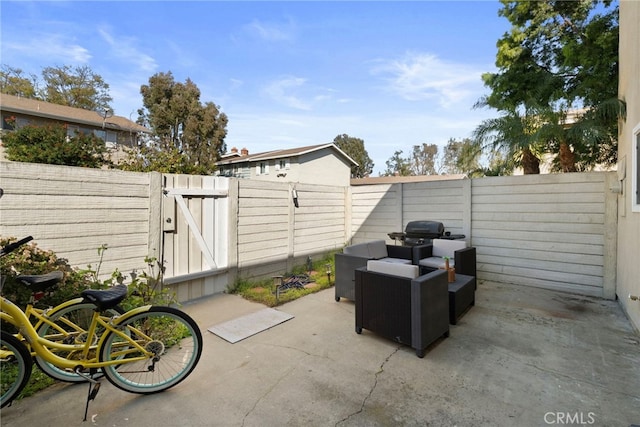 view of patio with a fenced backyard and a gate