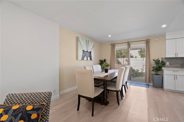 dining room featuring recessed lighting, baseboards, and light wood-type flooring