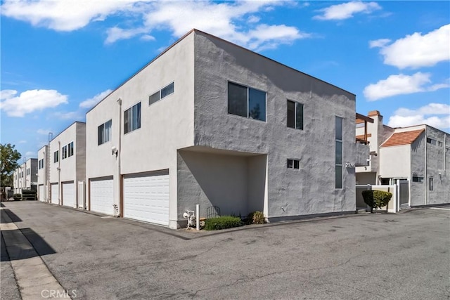 exterior space with a residential view and stucco siding