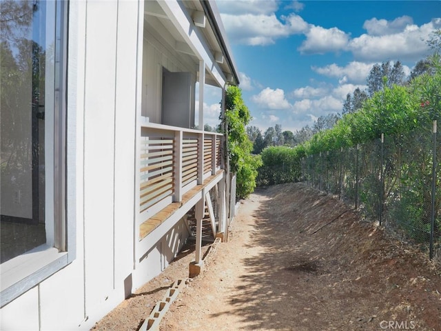 view of home's exterior with fence