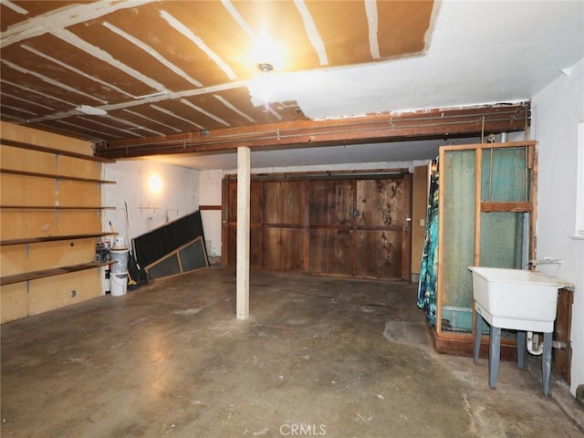 unfinished basement featuring a sink