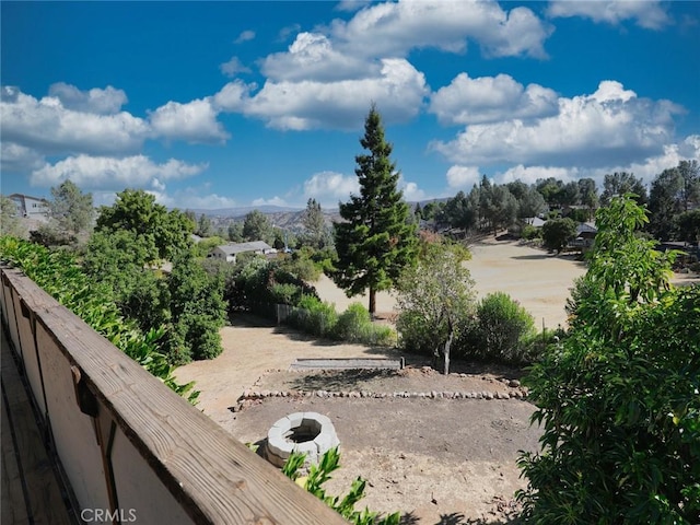 view of yard with a mountain view and fence