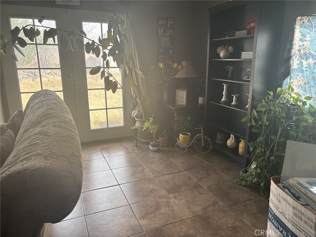 interior space with tile patterned floors and french doors