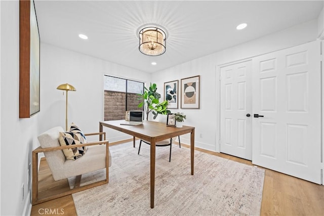 home office with recessed lighting, an inviting chandelier, baseboards, and wood finished floors