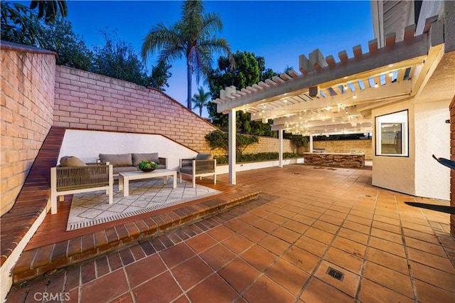 view of patio / terrace with an outdoor living space, fence, and a pergola