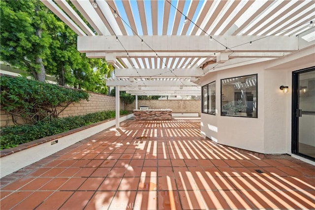 view of patio / terrace with a pergola and fence