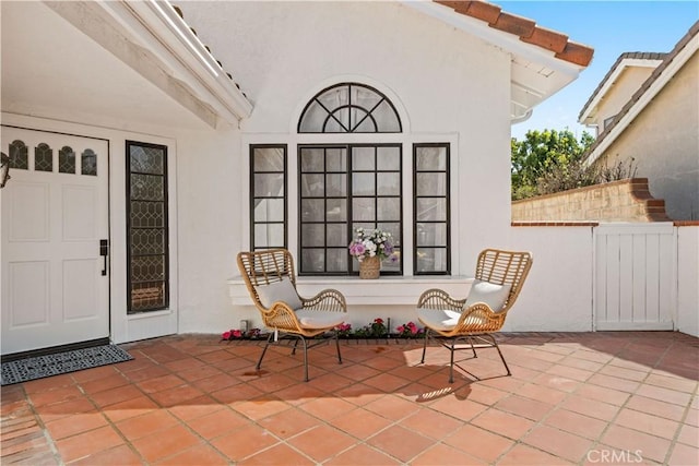 view of patio / terrace featuring fence