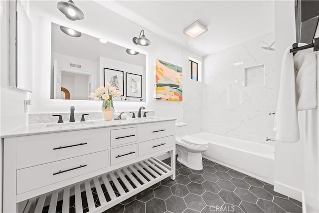 bathroom with tile patterned flooring, shower / washtub combination, toilet, double vanity, and a sink