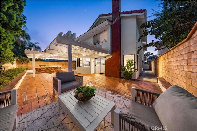 wooden terrace featuring an outdoor hangout area, a patio, a fenced backyard, and a pergola