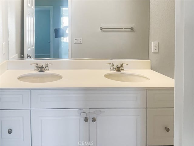 bathroom with double vanity and a sink