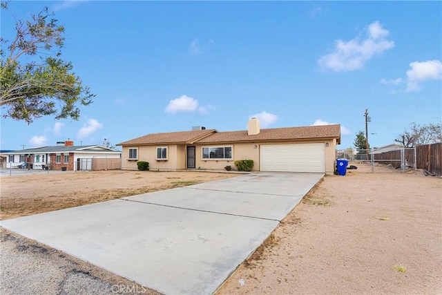 ranch-style home featuring fence, stucco siding, a chimney, driveway, and an attached garage