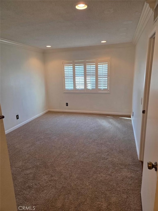 empty room with baseboards, ornamental molding, carpet flooring, recessed lighting, and a textured ceiling