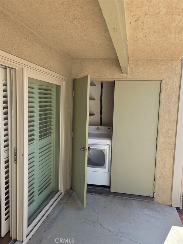 laundry area featuring washer / dryer and laundry area