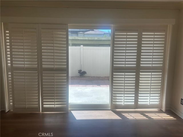 doorway with wood finished floors