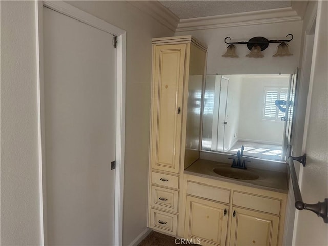 bathroom featuring vanity and ornamental molding