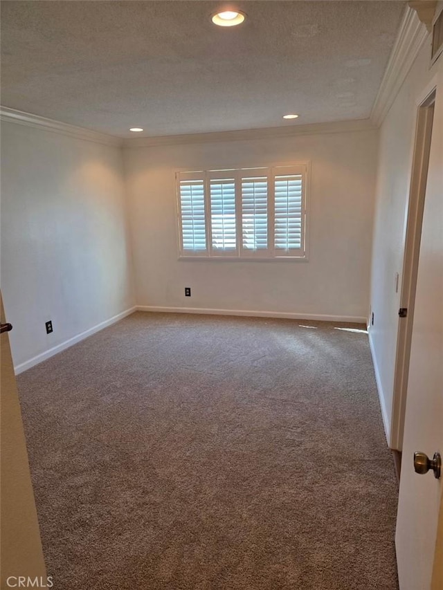 carpeted spare room featuring recessed lighting, a textured ceiling, baseboards, and ornamental molding