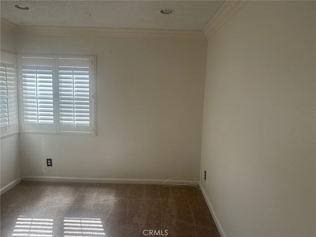 carpeted spare room with crown molding, baseboards, and a textured ceiling