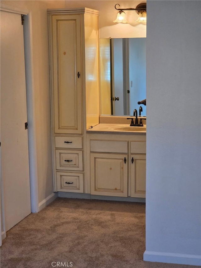 bathroom with vanity and carpet flooring