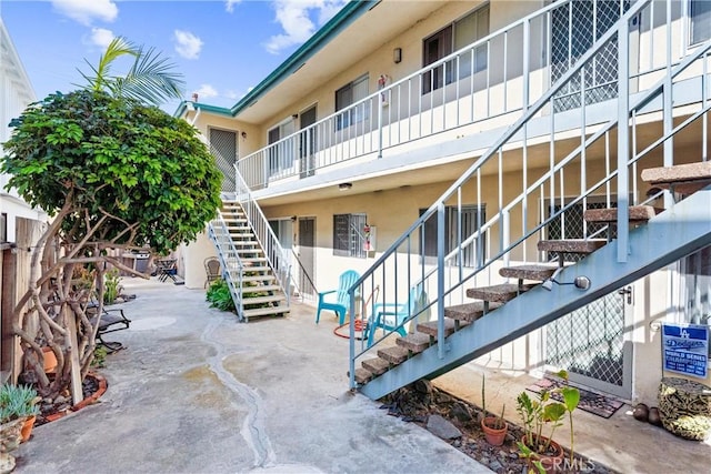 view of property featuring stairs