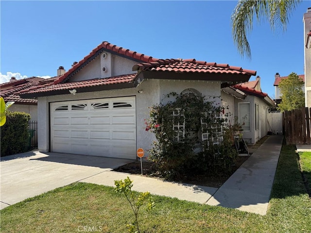 view of front facade featuring fence, stucco siding, concrete driveway, a garage, and a tiled roof