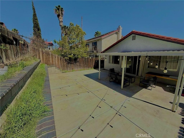 view of patio featuring a fenced backyard