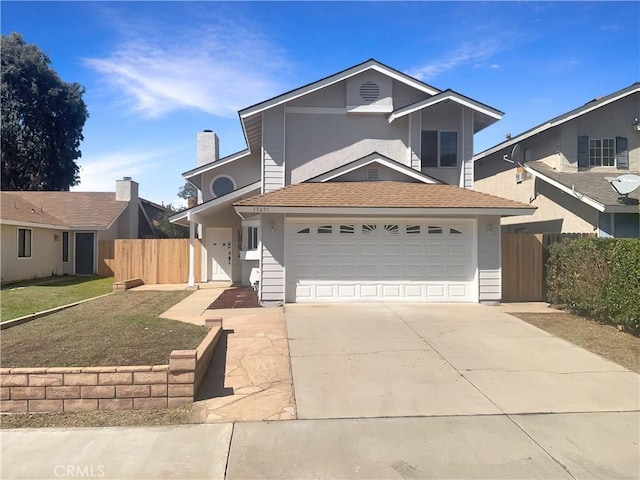 traditional-style house with concrete driveway, roof with shingles, a garage, and fence