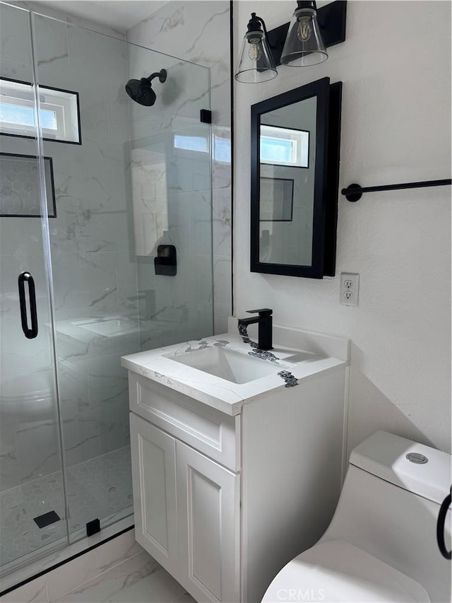 full bathroom with a wealth of natural light, a marble finish shower, and marble finish floor