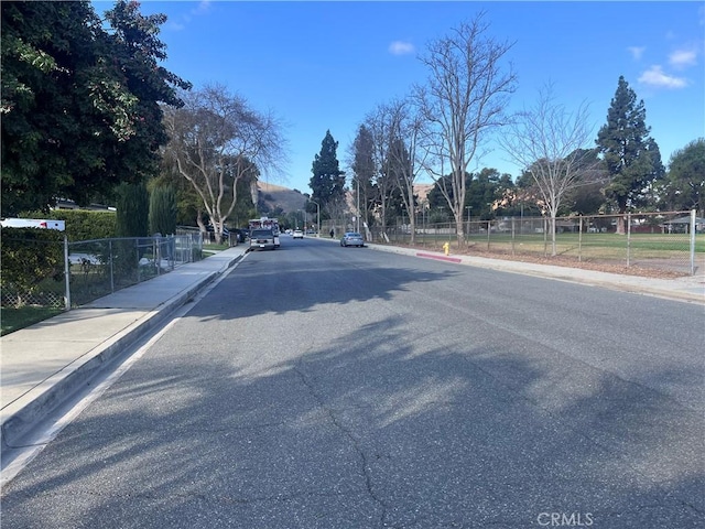 view of street featuring sidewalks and curbs